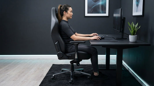 Side-view of a gamer in an ergonomic gaming chair, feet flat and upright posture — lumbar support for long sessions