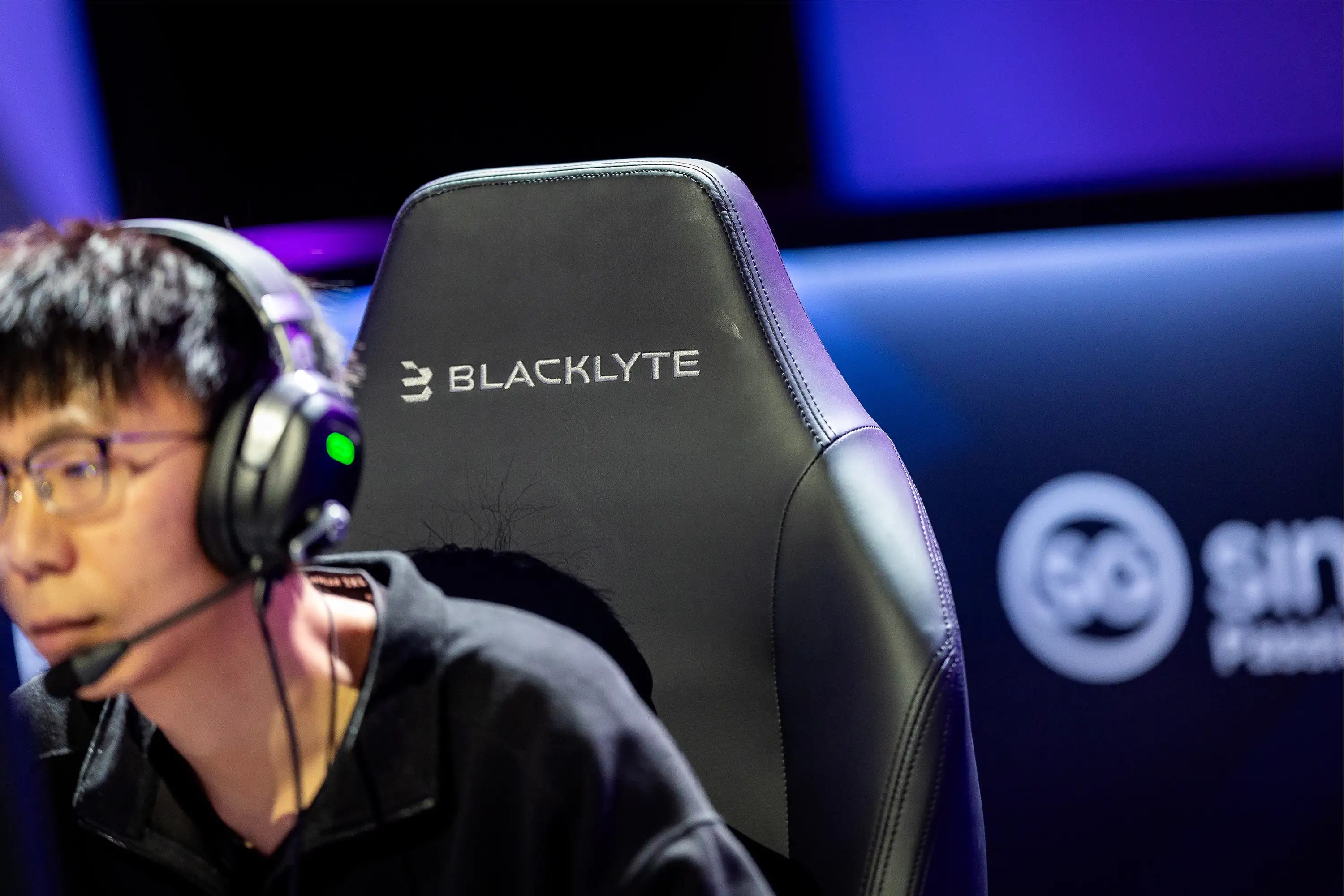 Focused Gamer Sitting on the Comfortable Blacklyte Gaming Chair