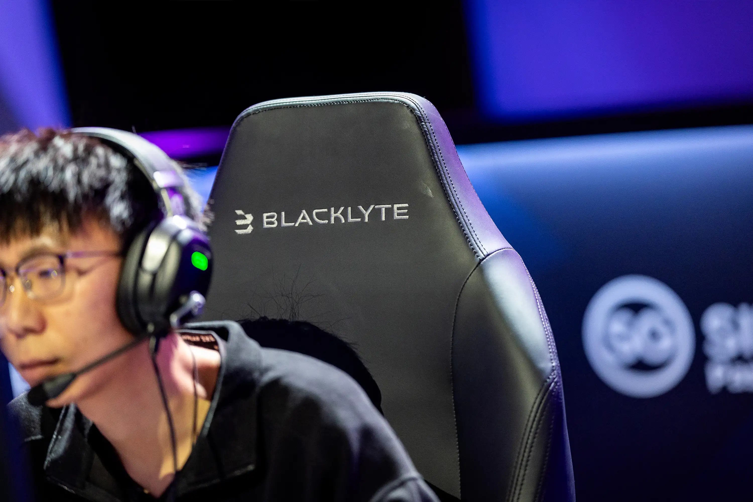 Focused Gamer Sitting on the Comfortable Blacklyte Gaming Chair
