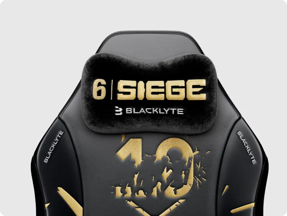 R6 10th Anniversary Edition gaming chair with a magnetic headrest pillow for comfort